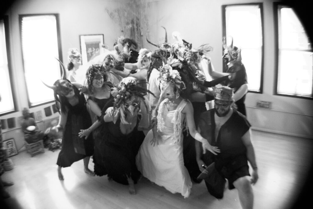 masked performers in motion